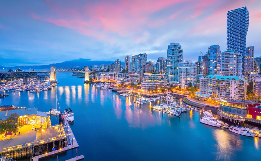 Vancouver skyline at sunset as seen from Stanley Park, British Columbia, Canada