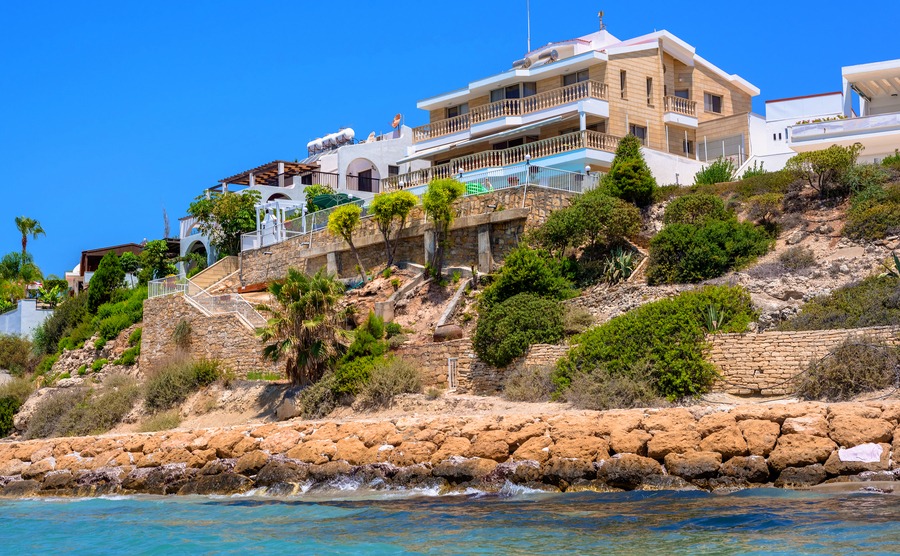 PAPHOS, CYPRUS - JULY 24, 2016: Luxury villas at the Coral Bay Beach near Pegeia village.
