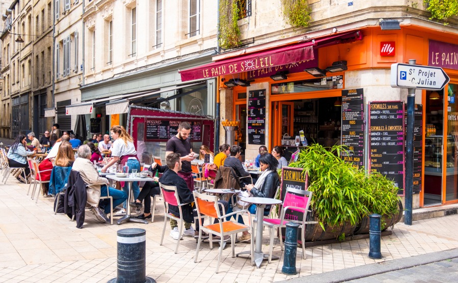 Regularly going to your local bar or café almost guarantees you'll become part of village life! kateafter / Shutterstock.com
