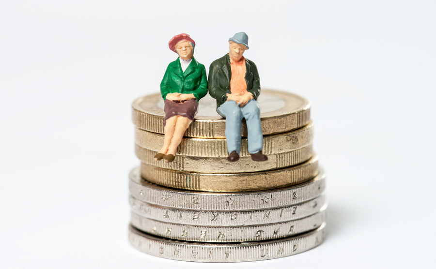 pension couple sitting om coins