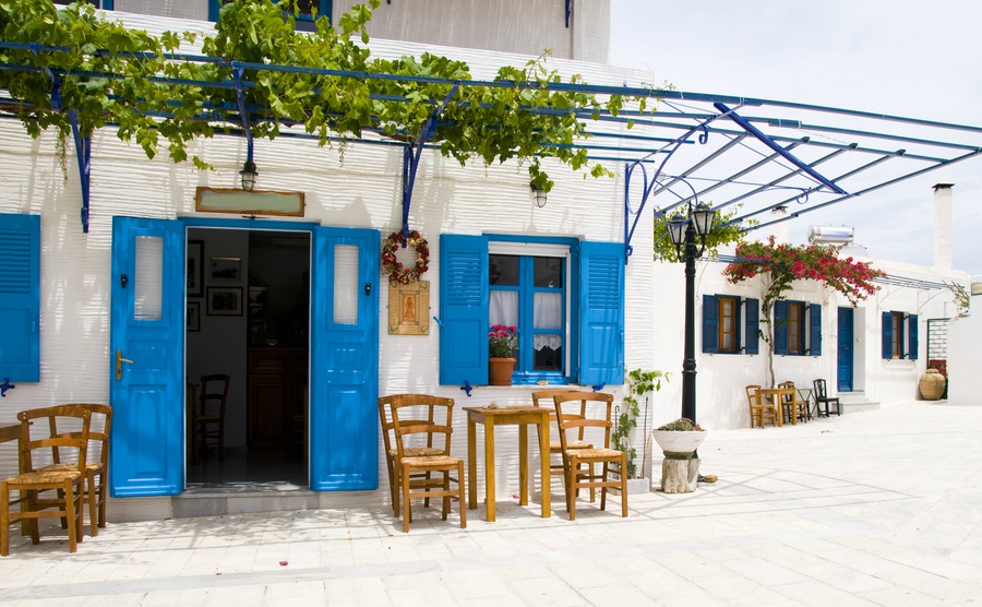 outdoor-cafe-setting-with-typical-greek-furniture-chairs