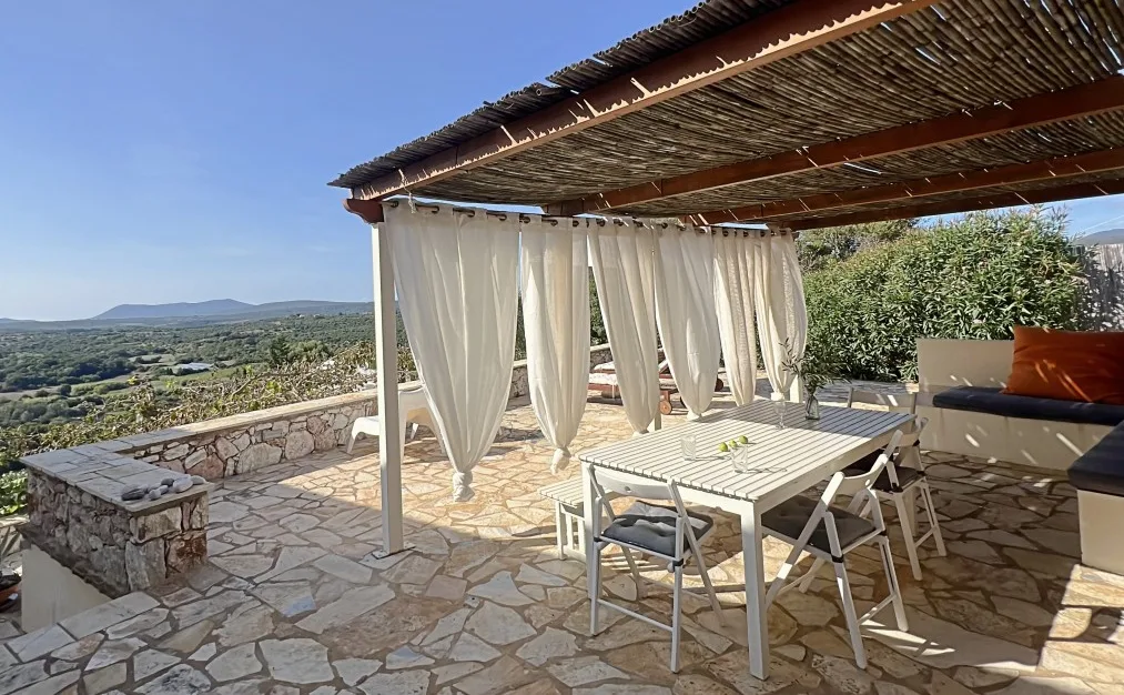 outside dining area in a Greek villa