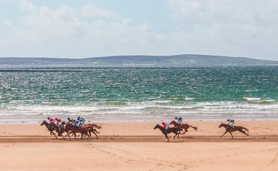 horses racing on the beach, Ireland.