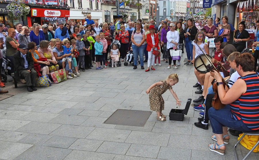 Fleadh Cheoil - people enjoying street music in Ireland.