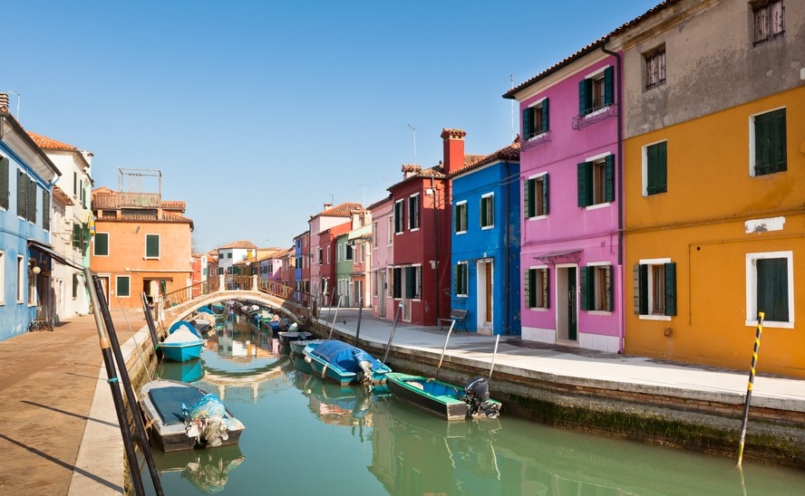 Colorful houses along canal in the island of Burano near Venice, Italy