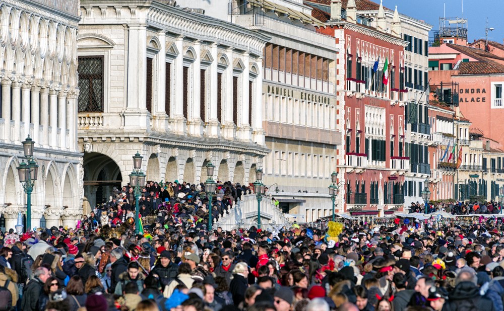 VENICE, ITALY - FEBRUARY 11: Overcrowded waterfront Riva degli Schiavoni on February 11, 2018 in Venice