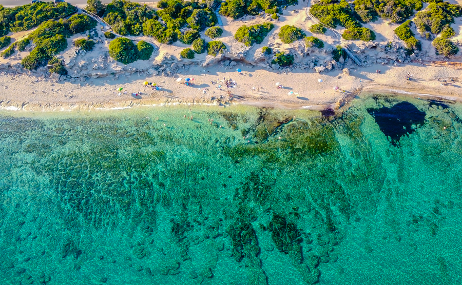 Punta Prosciutto is a wonderful stretch of Salento coast, part of the Municipality of Porto Cesareo, Puglia region, South Italy. long and unspoiled beach. Drone photo
