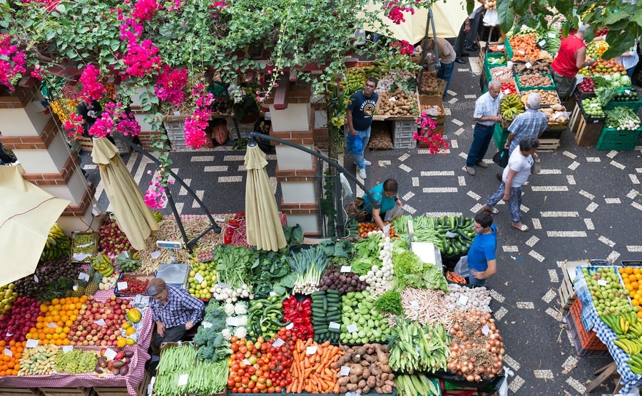 people-are-shopping-at-the-vegetable-market-of-the-famous-mercado-dos-lavradores-on-august-01-2014-in-funchal-capital-city-of-madeira-portugal