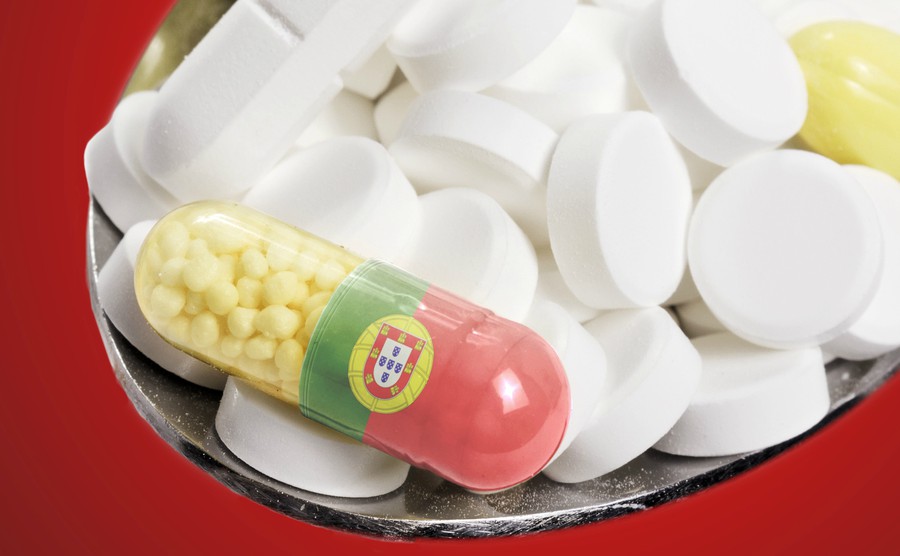 the-national-flag-of-portugal-on-a-capsule-and-pills-on-a-spoon-series