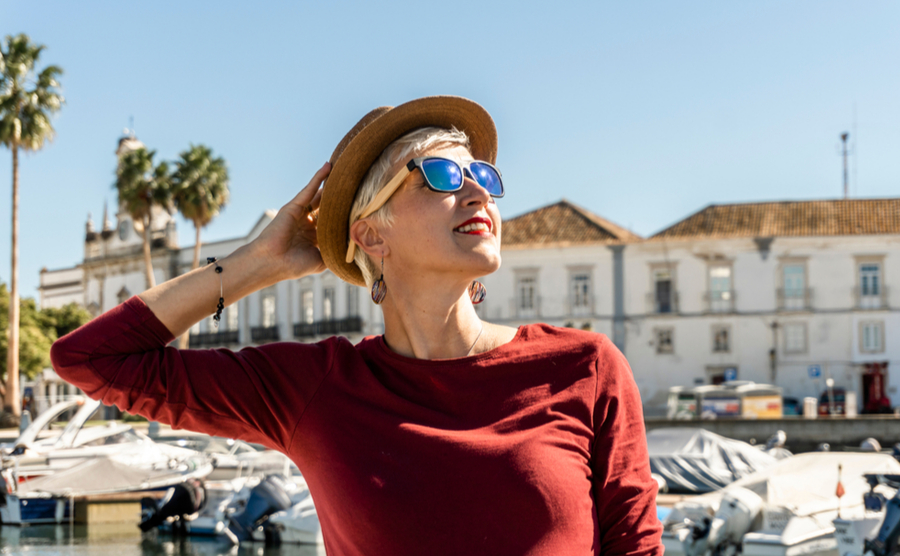 short-haired woman with sunglasses in the Algarve.