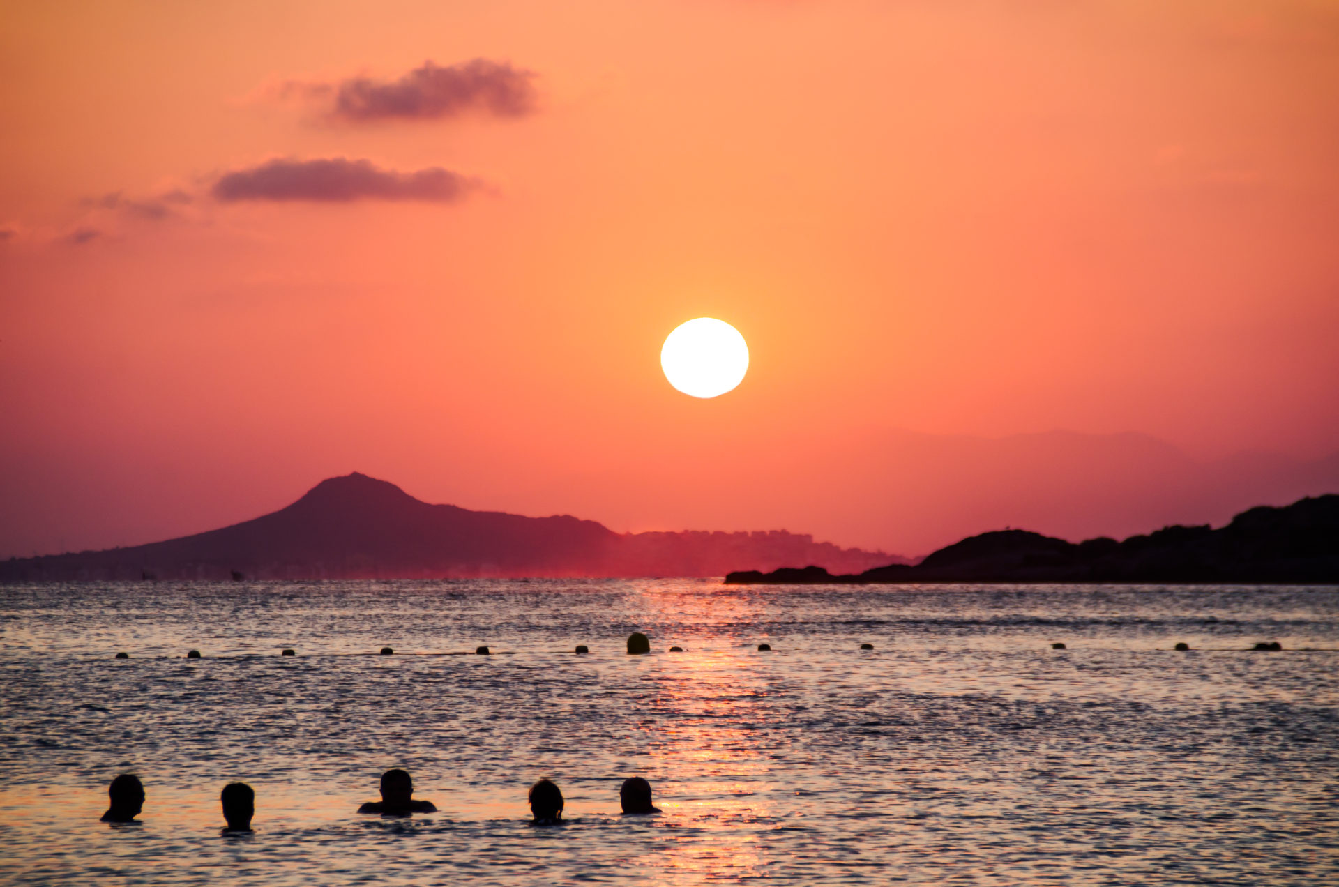 Swimming in the calm Mar Menor at sunset