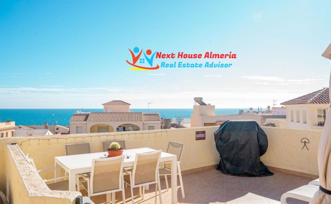 terrace with dining area and sea view. 