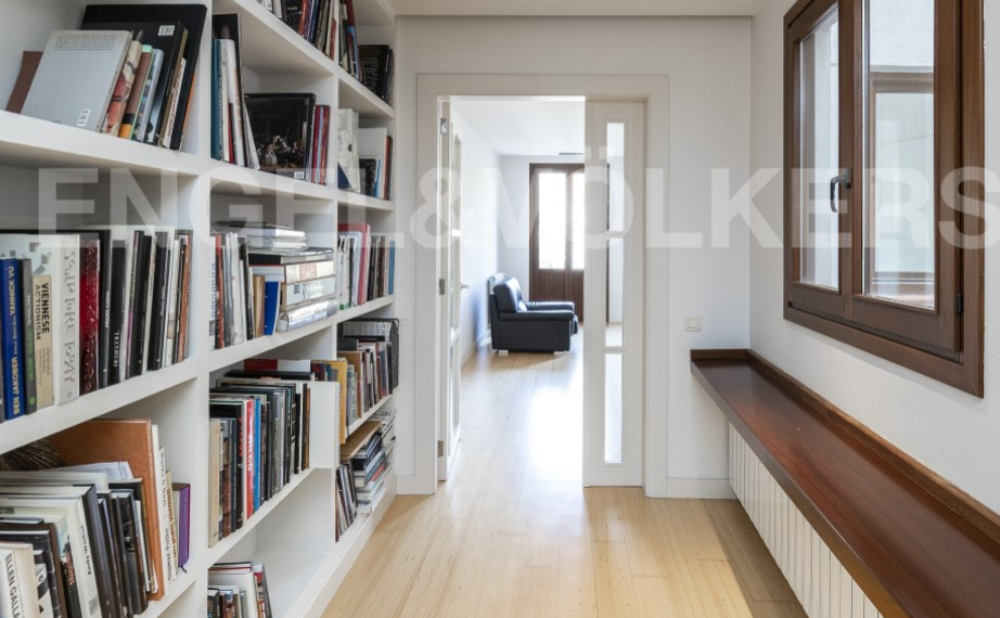 bookshelf leading to living room.