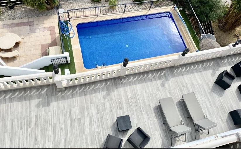 aerial view of a terrace and pool.