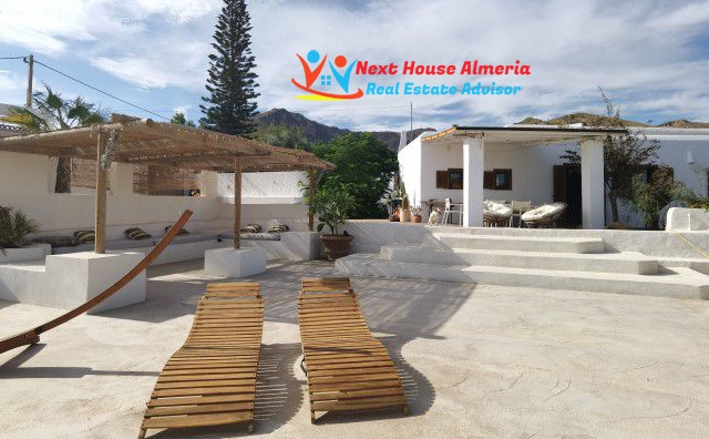 pool lounge area, mountains in background. 