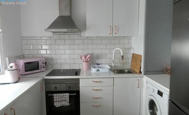kitchen with pink furnishings. 