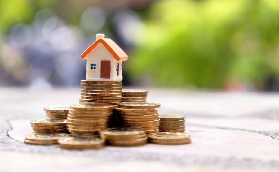 Coin stacks and house model on the top