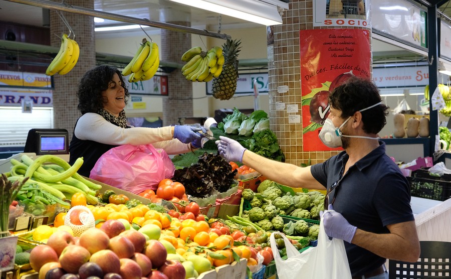 Markets, like this one in Alicante, are still open with sensible precautions being taken. Axel Alvarez / Shutterstock.com