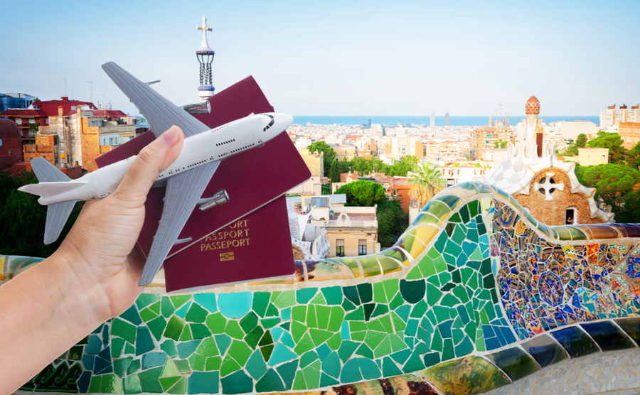 toy plane, passport, Spanish landscape backdrop.