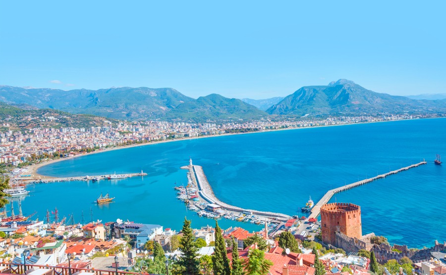 Landscape with marina and Red tower in Alanya peninsula, Antalya district, Turkey