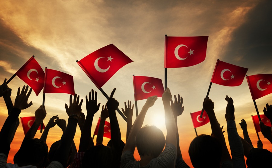 Silhouettes of People Holding the Flag of Turkey