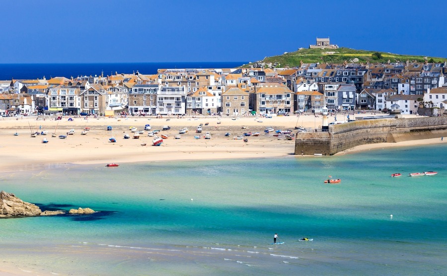 Beaches like Porthminster and an artistic scene make St Ives a popular place for buying a house in Cornwall.