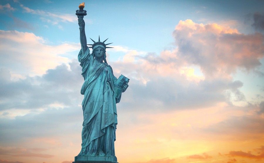 statue-of-liberty-on-the-background-of-colorful-dawn-sky